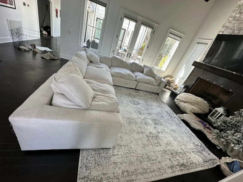 White sectional sofa in a living room after upholstery cleaning